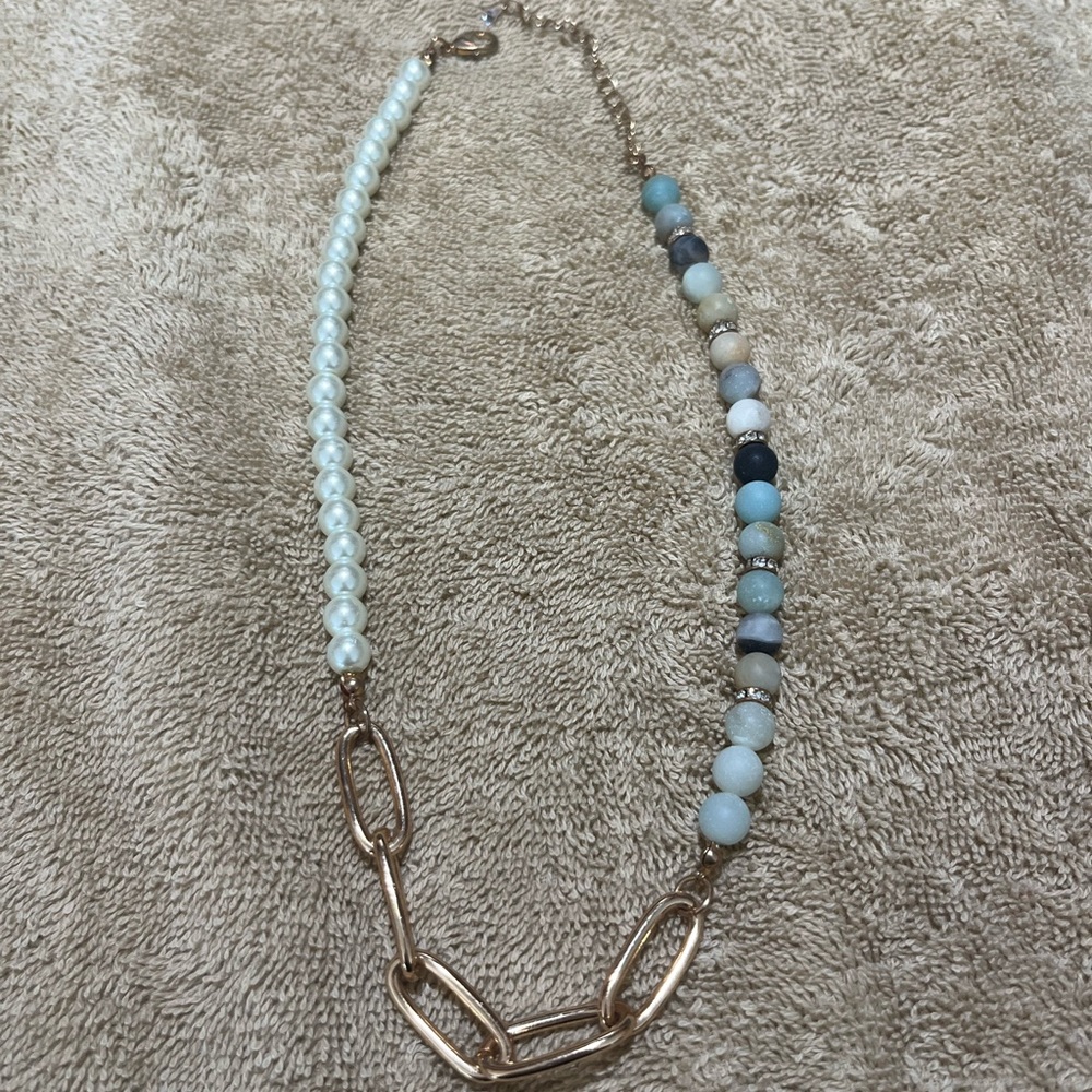 Gold and stone necklace.